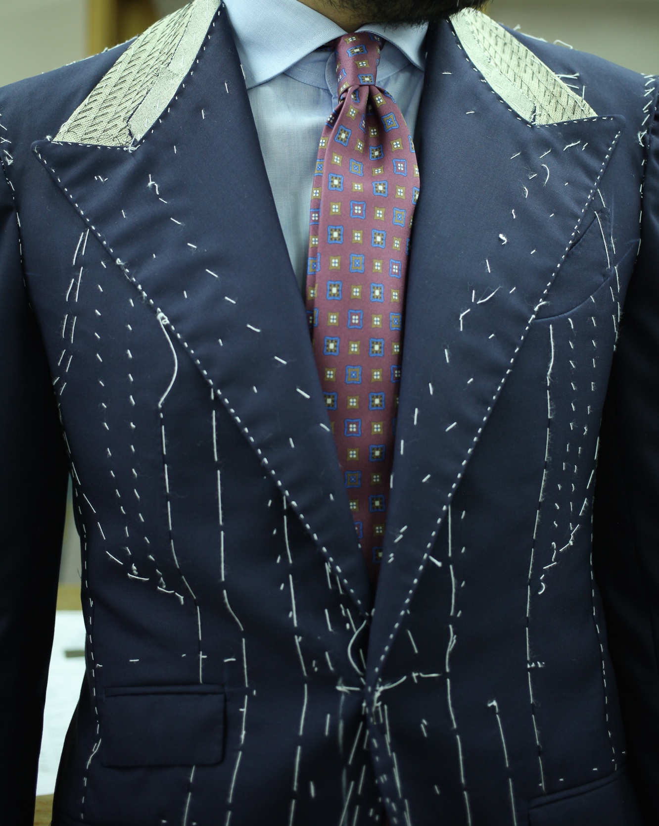 Edesim - Concave Lapel Line Fitting of a three-piece suit made from Holland&Sherry fabric