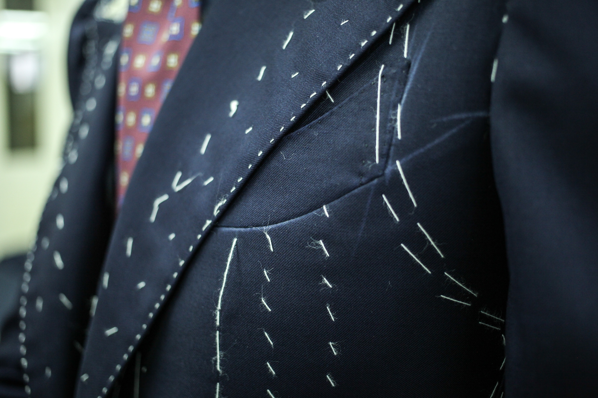 Edesim - Concave Lapel Line Fitting of a three-piece suit made from Holland&Sherry fabric